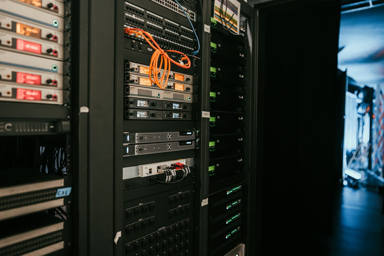 Racks of servers and network equipment inside a data centre